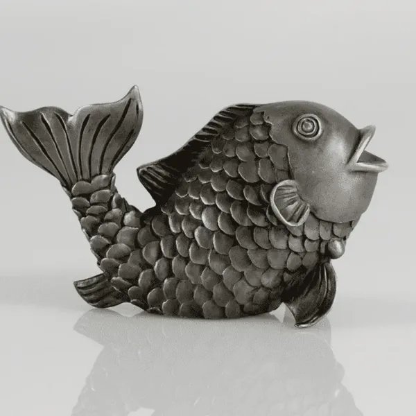 Silver sculpture of a fish with finely chased scales